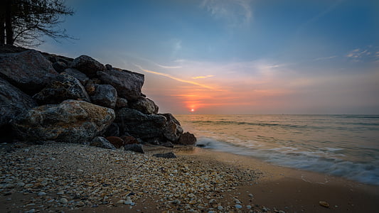 body of water during sunset thumbnail