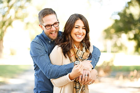 Portrait of Happy Young Woman Using Mobile Phone in City thumbnail