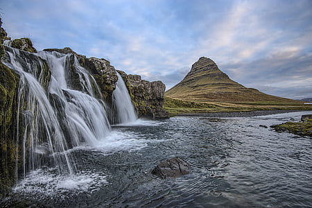 photography of waterfall with brown mountain on background thumbnail
