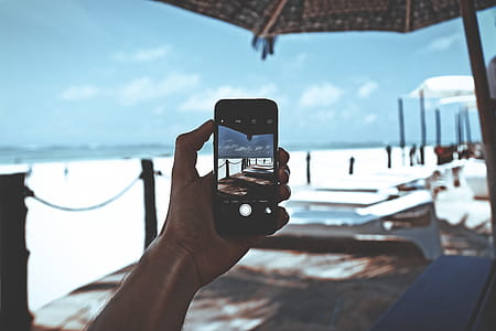 Person Holding Space Gray Iphone 6 thumbnail