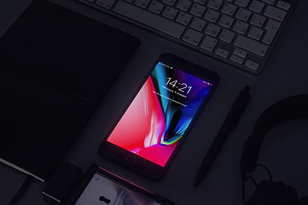 black Android smartphone near click pen thumbnail
