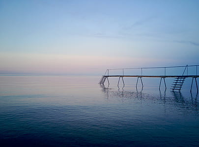 brown wooden dock on body of water thumbnail