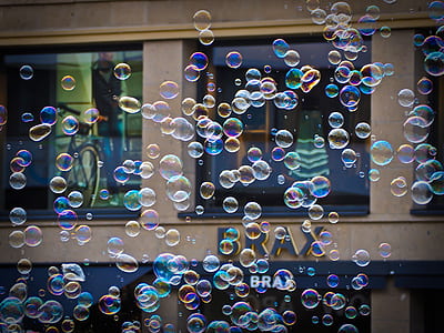 macro photography of floating bubbles outdoors thumbnail