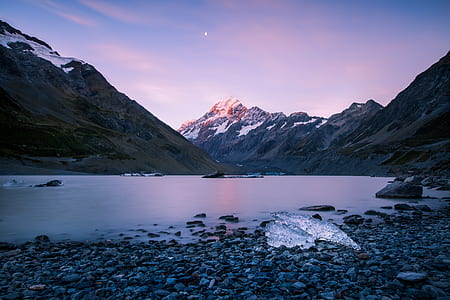 river near mountain alps under calming sky thumbnail