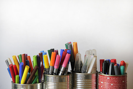 assorted colored markers in stainless steel canisters thumbnail