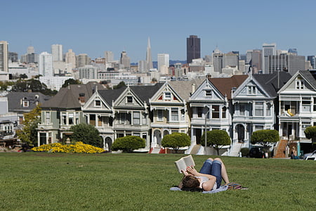 woman lying on green grass field thumbnail