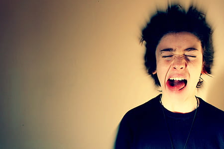man wearing black crew-neck shirt opening his mouth thumbnail