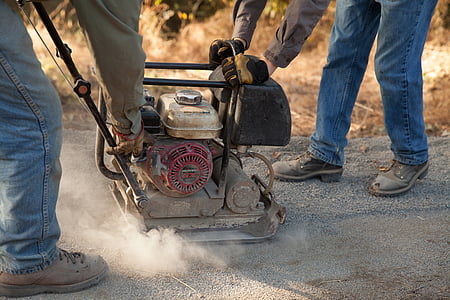two people holding gas stamper during daytime thumbnail
