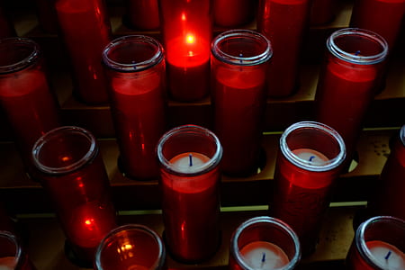 high angle photo candle inside red candle holder lot thumbnail