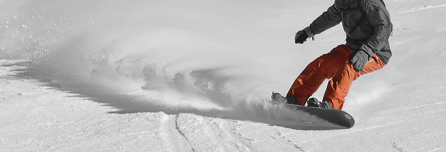man wearing orange pants riding snowboard thumbnail