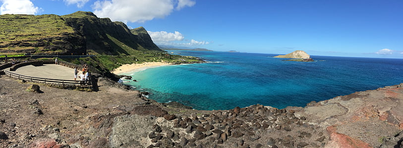 photo of person standing near beach under blue sky at daytime thumbnail