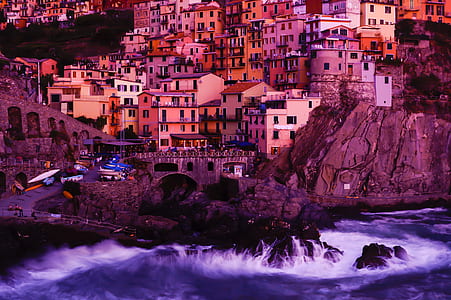 ocean wave rushing to rock riprap Santorini, Greece thumbnail
