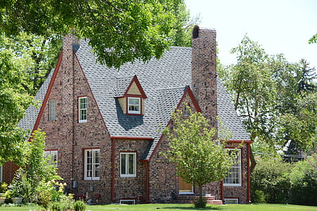 brown bungalow house surrounded with trees thumbnail