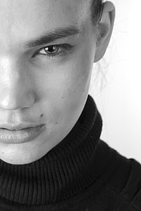 person wearing black turtle-neck sweater  photo thumbnail
