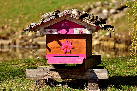 orange and pink wooden house figure thumbnail