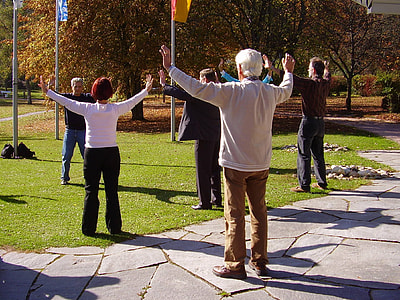 people doing zumba in the park during day time thumbnail