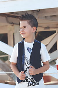 boy standing in front of building thumbnail