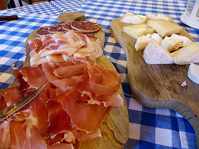 raw meats on chopping boards thumbnail