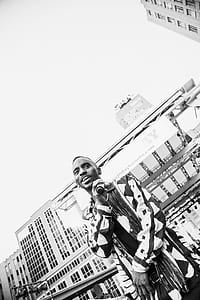 grayscale photo of man holding black mic thumbnail