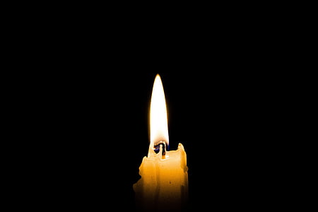 lighted white candle thumbnail