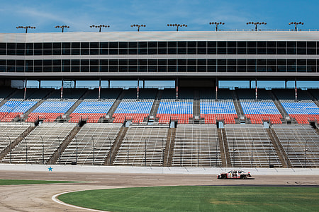 race car roaming around race track thumbnail