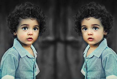 toddler girl wearing gray chambray collared button-up short-sleeved shirt in mirror photography thumbnail