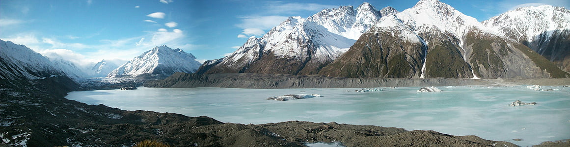 landscape photography of sea and mountains thumbnail