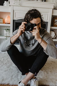 man doing photography using SLR camera thumbnail