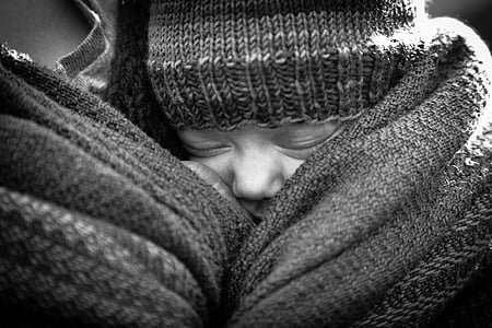 grayscale photo of person carrying baby thumbnail