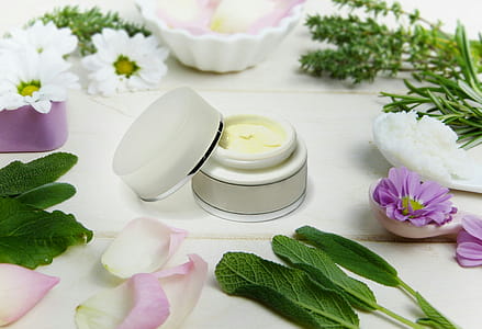 Cream with botanical ingredients surrounding the jar. thumbnail