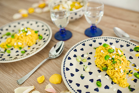 Risotto with broad bean on a cute plate with blue hearts thumbnail