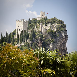 gray concrete building on mountain under blue sky at daytime thumbnail