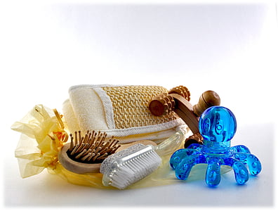 brown brush beside blue octopus massager thumbnail