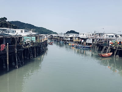boats near houses at daytime thumbnail