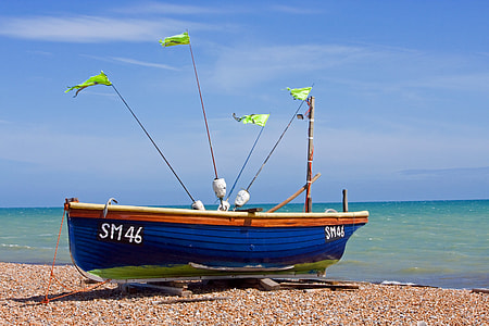 blue and brown boat docked near body of water at daytime thumbnail