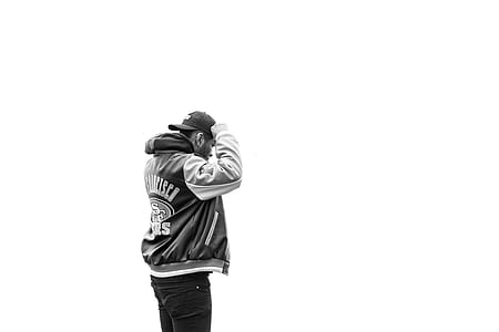 grayscale photography of man wearing cup thumbnail
