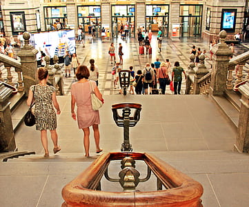 people walking on staircase inside building thumbnail