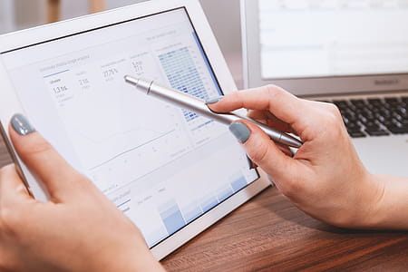 Business person analyzing Google Analytics on tablet thumbnail