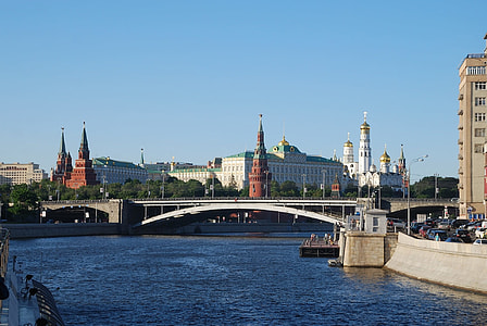 white concrete bridge near high-rise building at daytime thumbnail