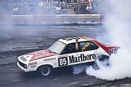 white and red Marlboro stock car on racing track thumbnail