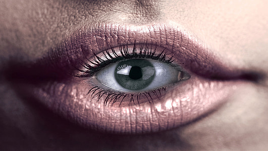 human mouth with an eyeball thumbnail