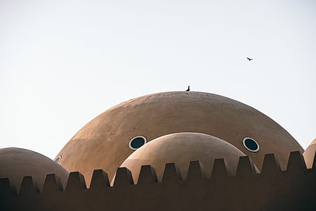 round brown concrete building thumbnail