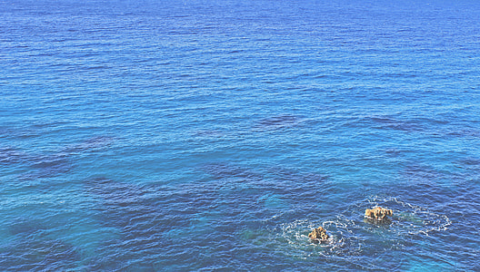 aerial photo of body of water during daytime thumbnail