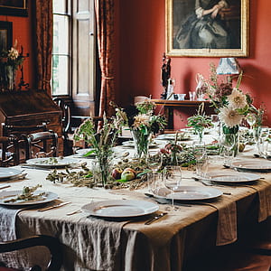 round white ceramic plates on top of dining table thumbnail