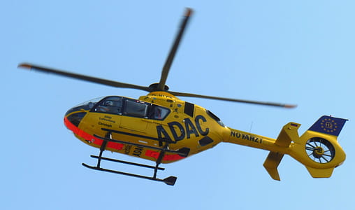 yellow helicopter on flight during daytime thumbnail