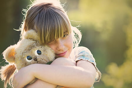 girl hugging gray cat thumbnail