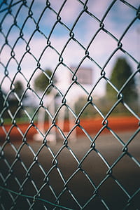 focus photo of gray chain link fence thumbnail