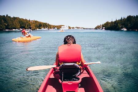 Kayaking in a red kayak in the lake thumbnail