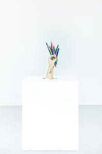 person holding assorted-color pen lot thumbnail