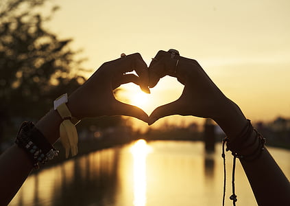 person doing heart hand sign thumbnail